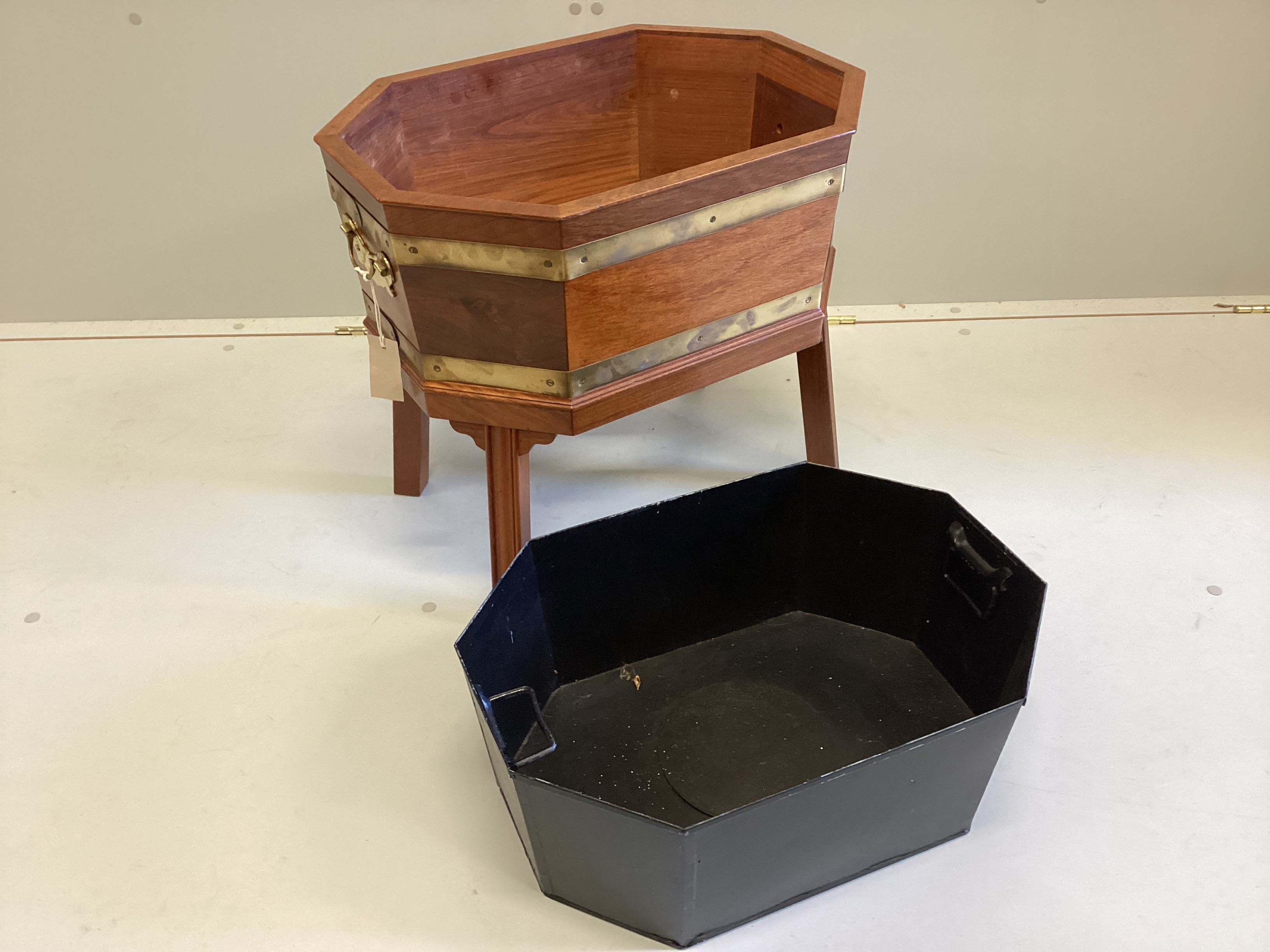 A George III style brass bound octagonal mahogany wine cooler, width 54cm, depth 39cm, height 48cm